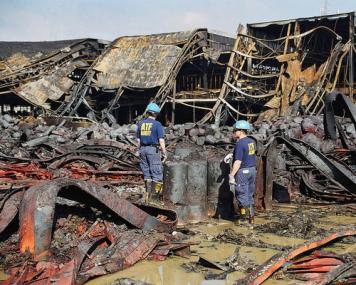 Certified Fire Investigators examining a scene Certified Fire Investigators examining a scene